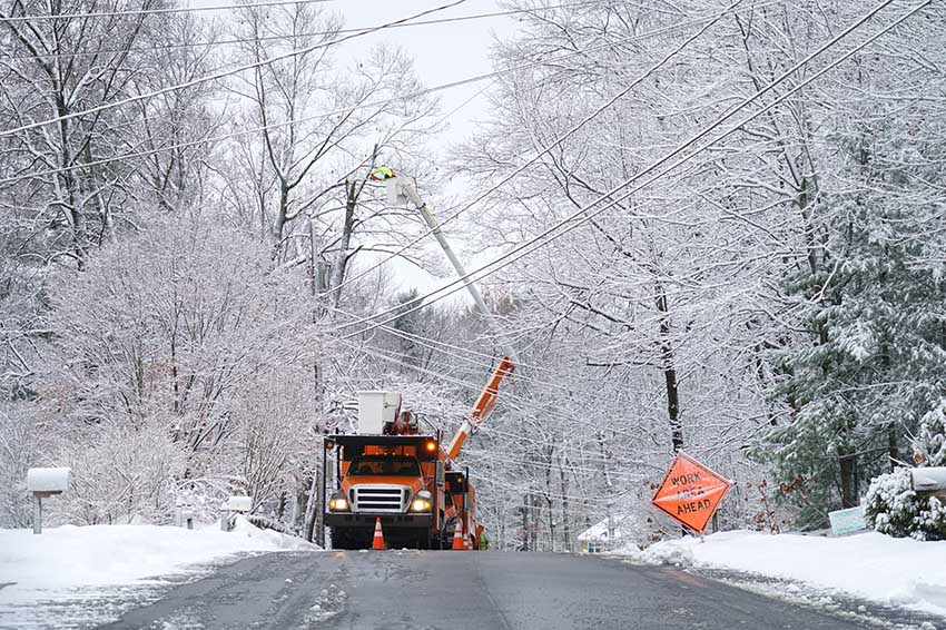 Faculty-Op-Ed-Serena-Kim Worker repairing electrical line after winter snow storm