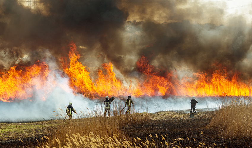Firefighters contending with a wildfire
